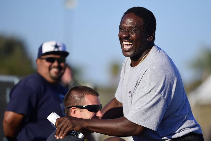 Former Dallas Cowboys player Nate Newton, hams it up for fans during the afternoon practice...
