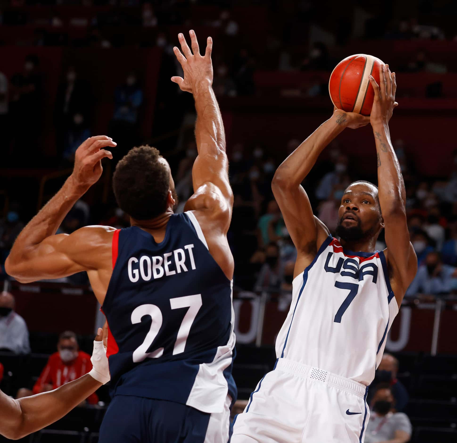 USA’s Kevin Durant (7) attempts a shot in front of France’s Rudy Gobert (27) during the...