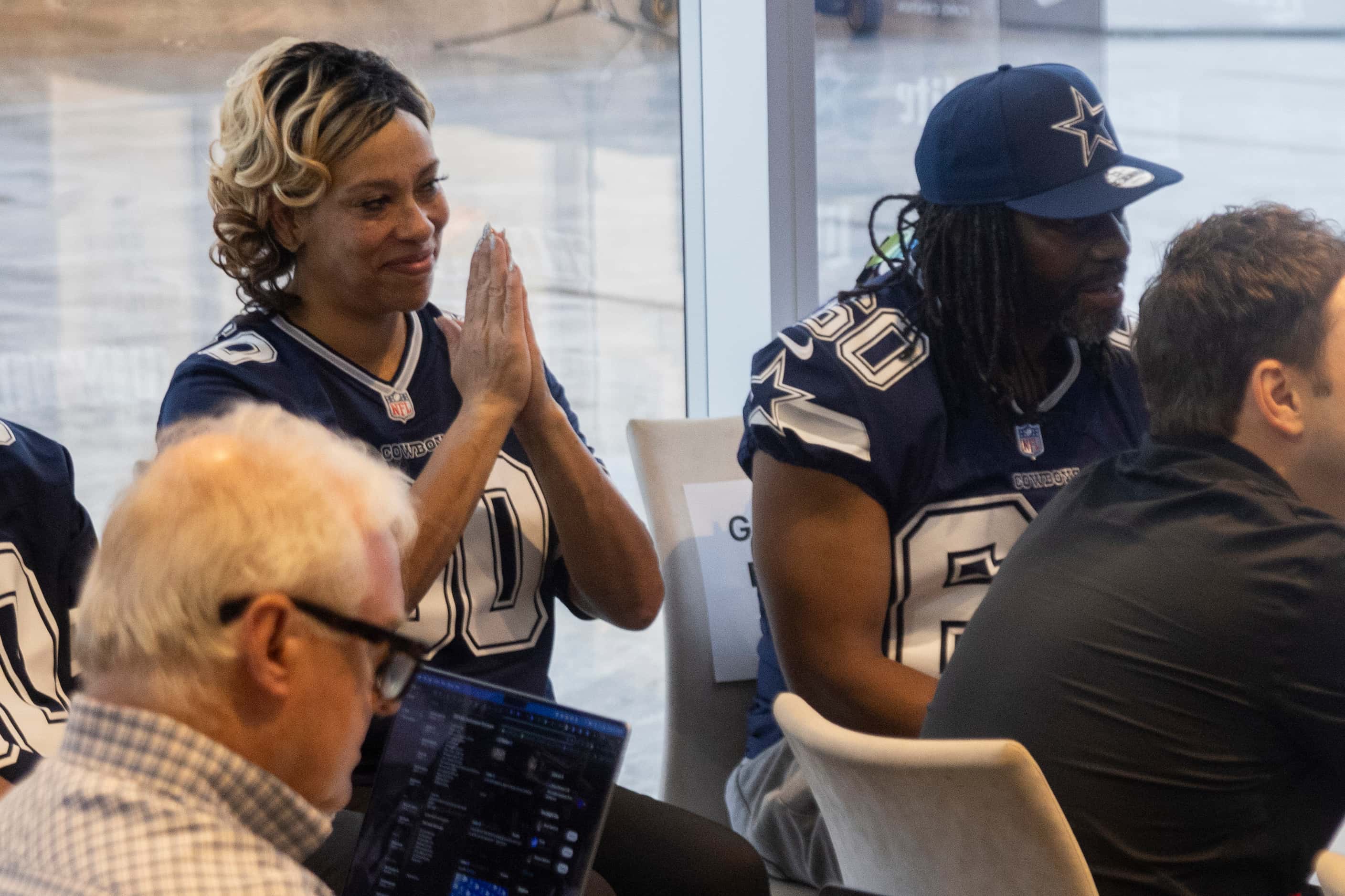 Makenzie Heimbecker, left, and Alvin Guyton react as their son, the new Dallas Cowboys left...