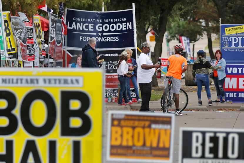 Early voters ran a gauntlet of signs as they arrived at a Mesquite polling place in October.