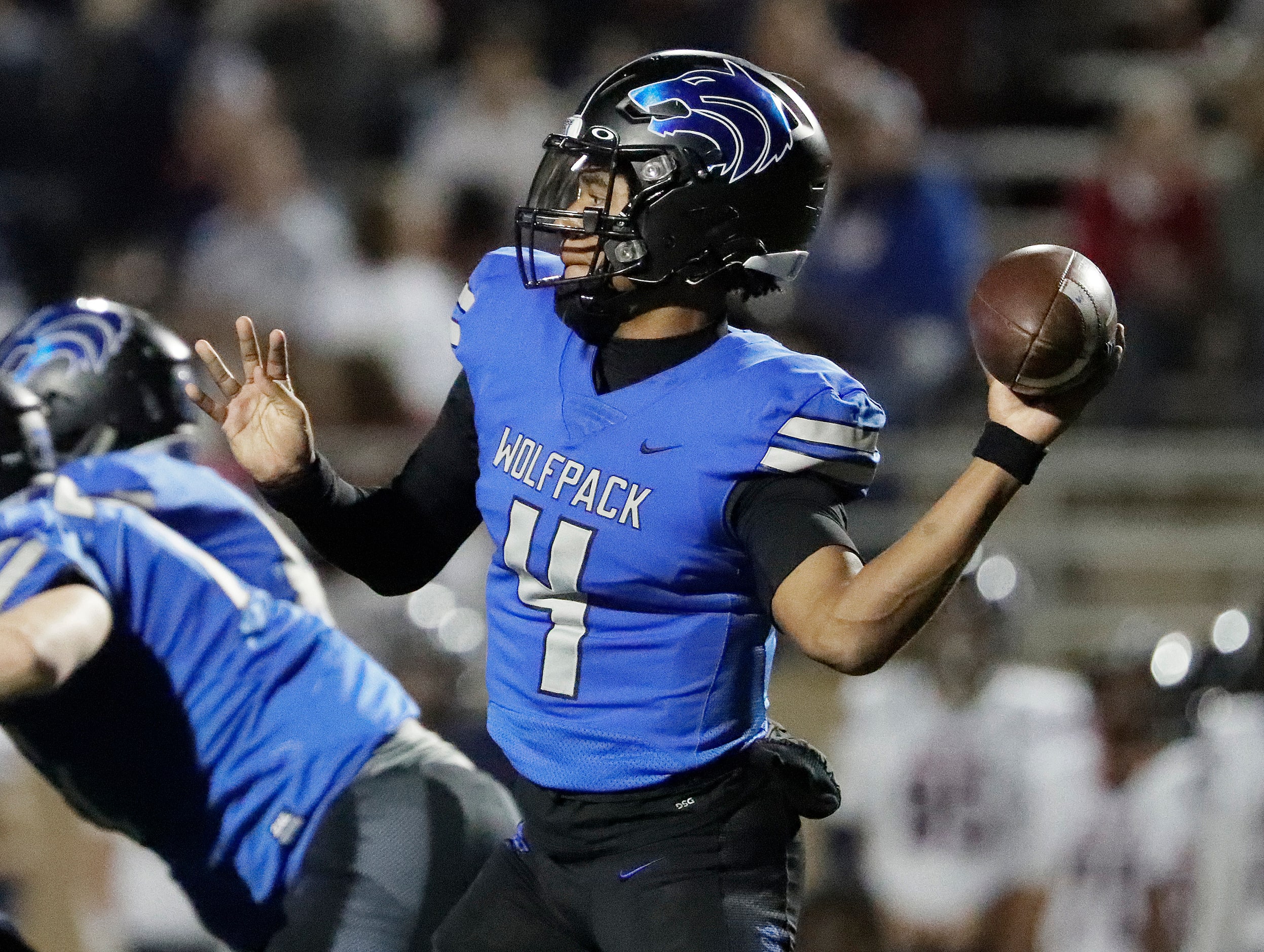 Plano West High School quarterback Jordan Grant (4) throws a pass during the first half as...