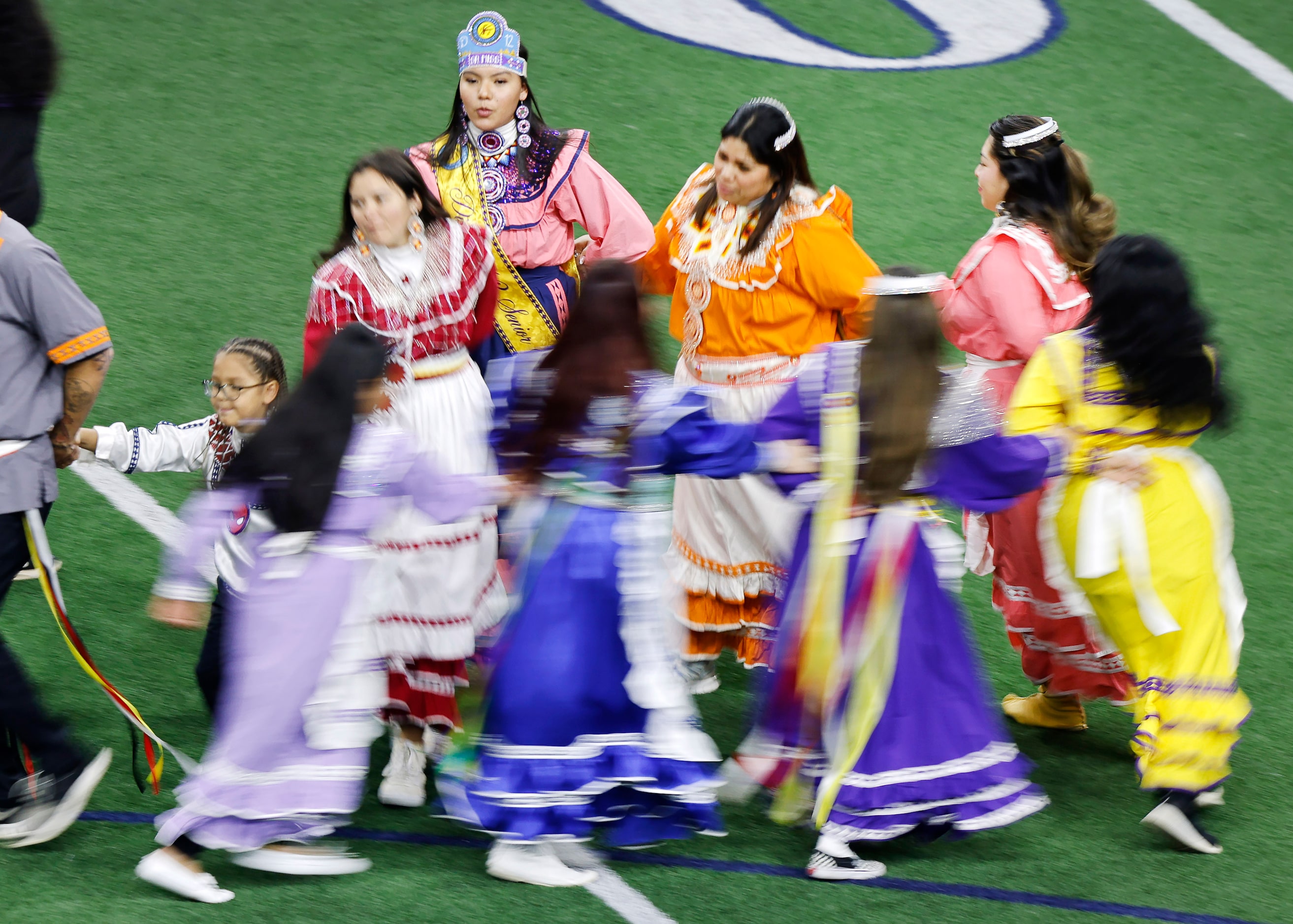 Native American dancers perform on the field before the Native American All-Star Football...