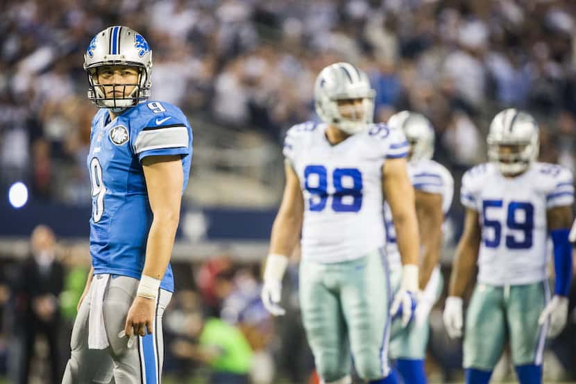 Detroit Lions quarterback Matthew Stafford (9) looks back toward his bench during the fourth...