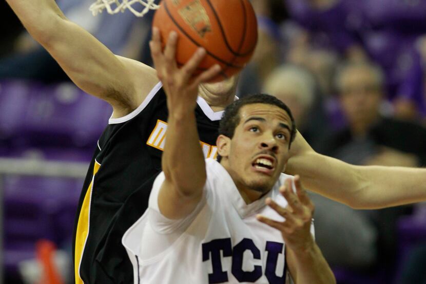 TCU Horned Frogs forward Amric Fields (4) makes a reverse layup against the Milwaukee...