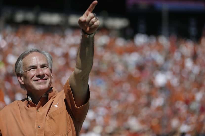 Texas Governor Greg Abbott on the sideline in the first half during an NCAA football game...