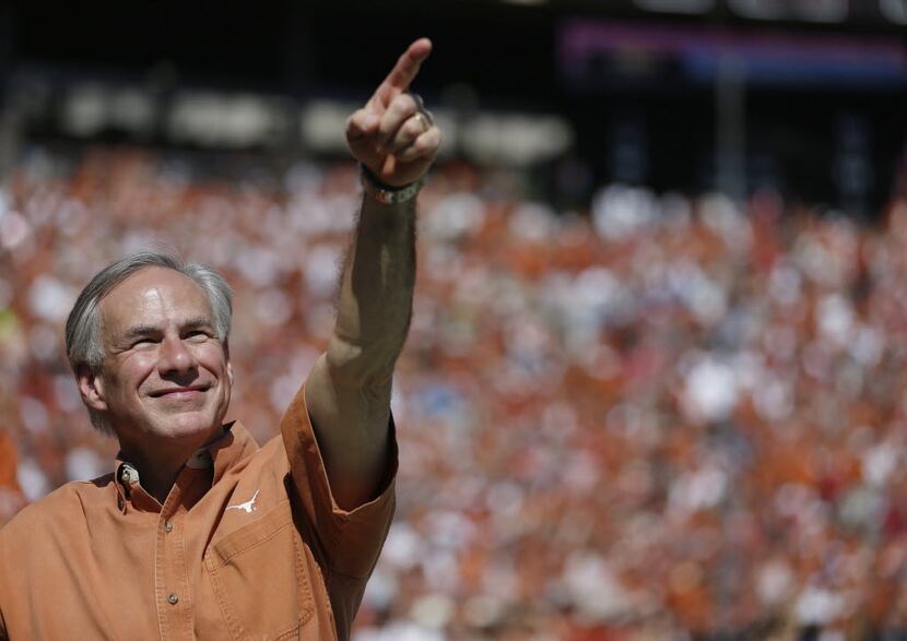Texas Governor Greg Abbott on the sideline in the first half during an NCAA football game...