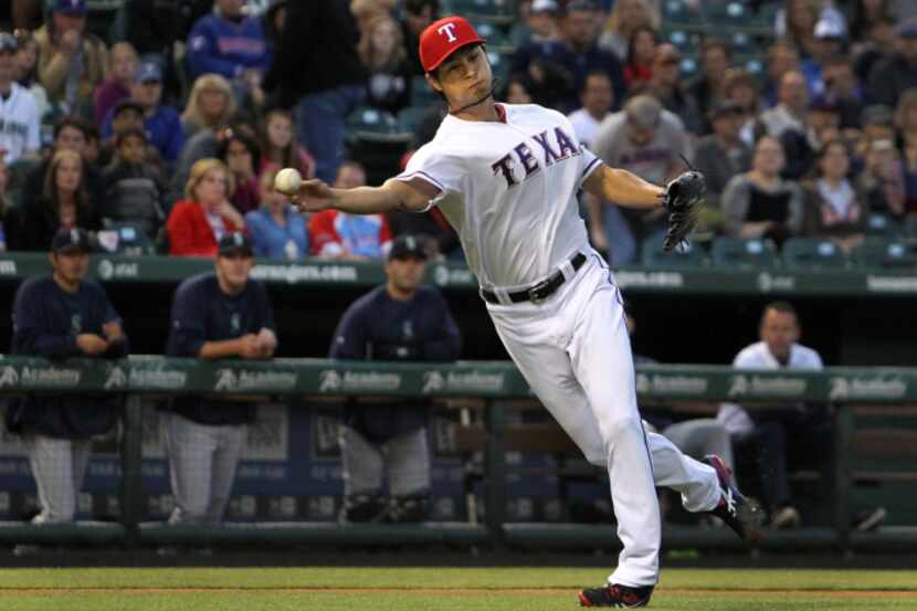 Texas outfielder Josh Hamilton hits a solo homer in the sixth inning during the Texas...