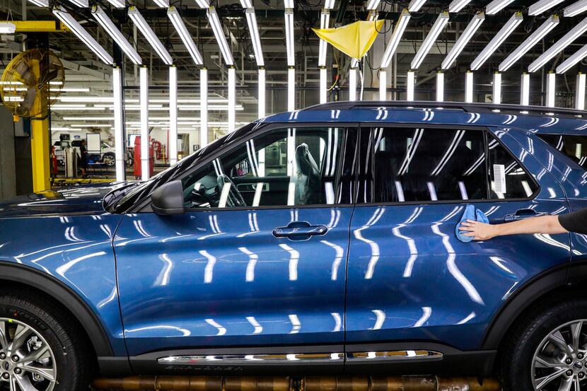 In this June 24, 2019, file photo a Ford employee works on a Ford Explorer line at Ford's...