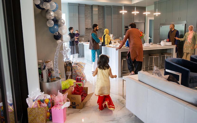 Family members celebrate Eid at Abdul Hayee and Qudsia Nadeem's home on May 24 in Plano.