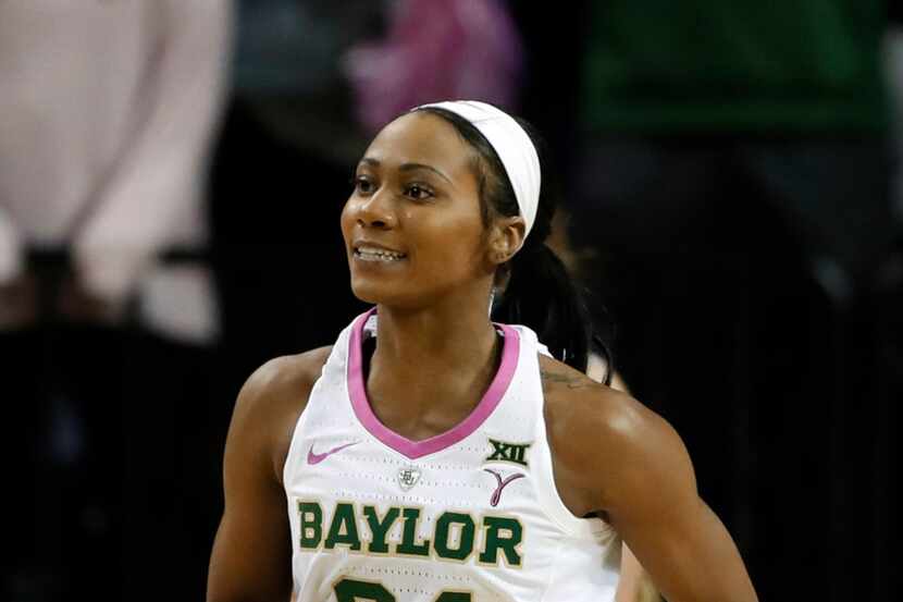 Baylor guard Chloe Jackson (24) smiles as she jogs to the bench during a timeout after...