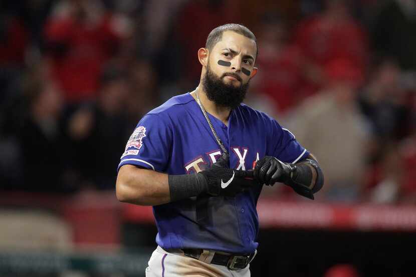 Texas Rangers' Rougned Odor reacts after striking out in the fifth inning of the team's...