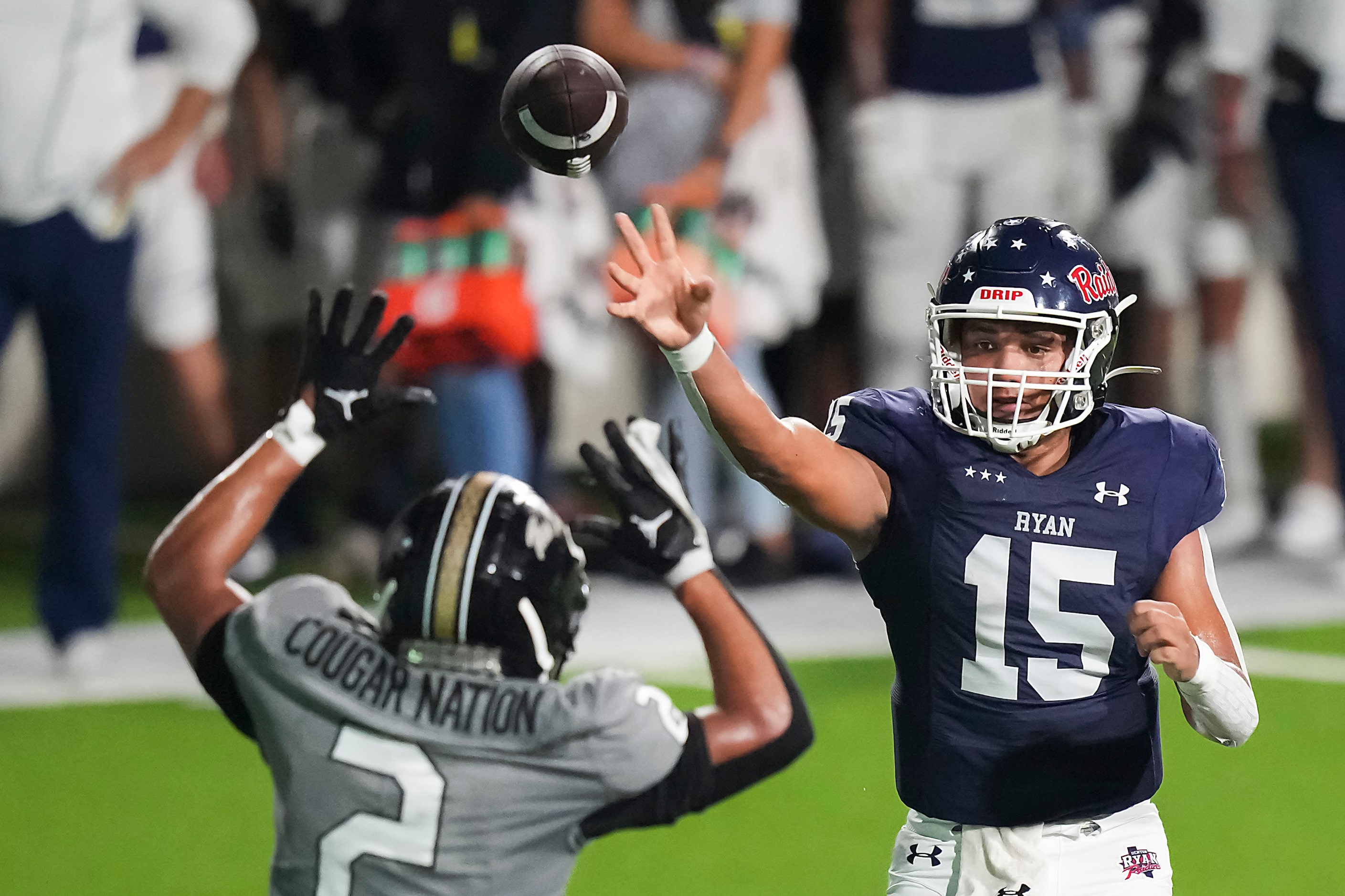 Denton Ryan quarterback TJ Hobbs (15) throws a pass over The Colony’s Dominic Scales (2)...