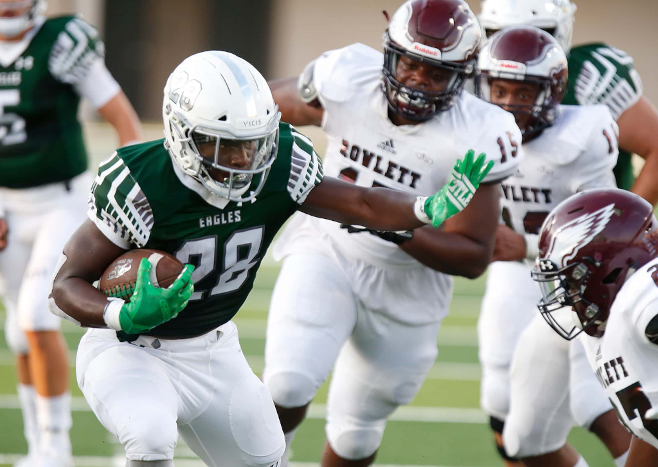 Prosper High School running back JT Lane (28) carries the ball into the end zone during the...