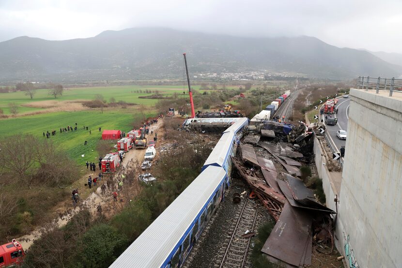 A crane operator, firefighters and rescue personnel work the scene of the accident. The...