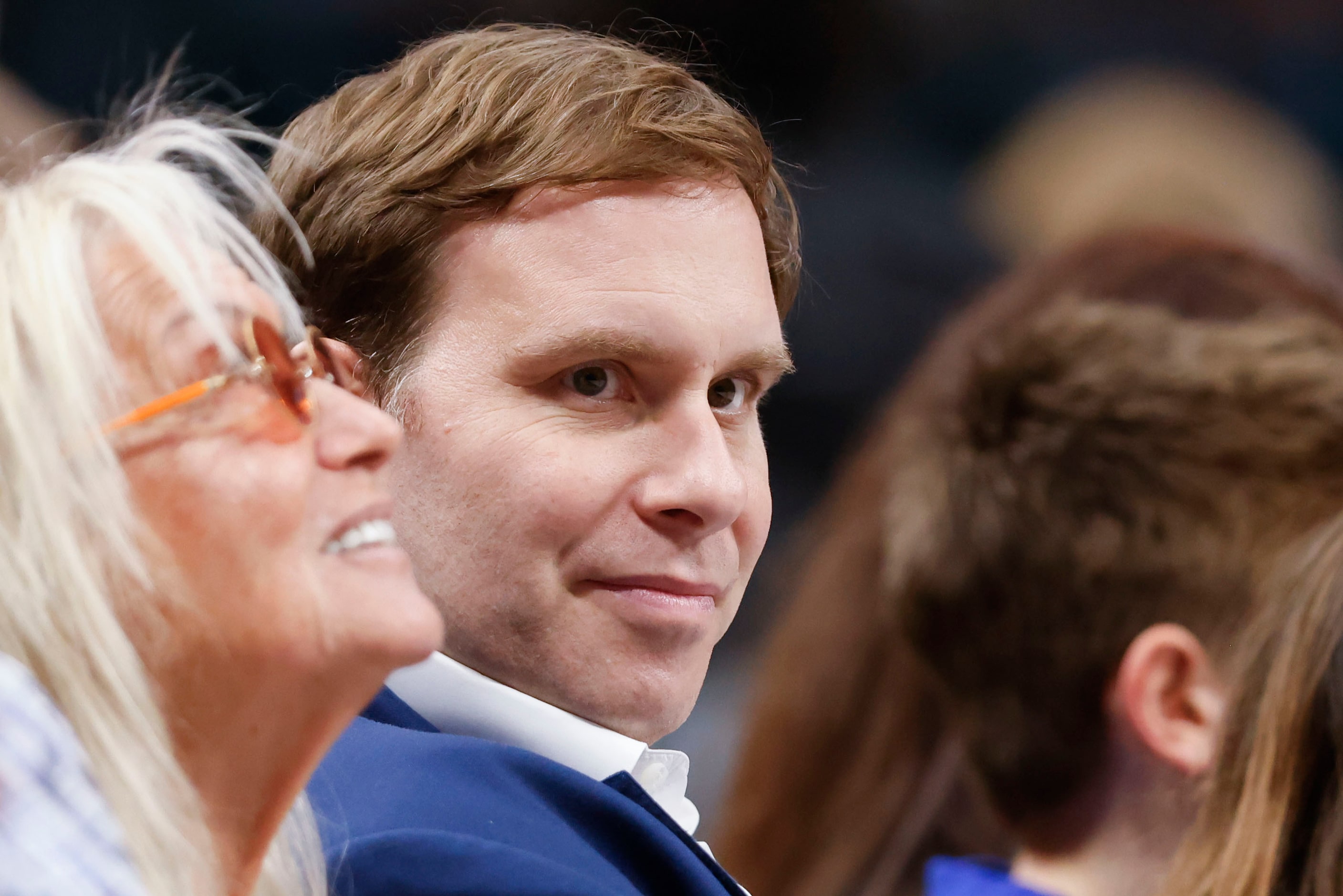 Mavericks Governor Patrick Dumont (center) remains in the court side during the first half...