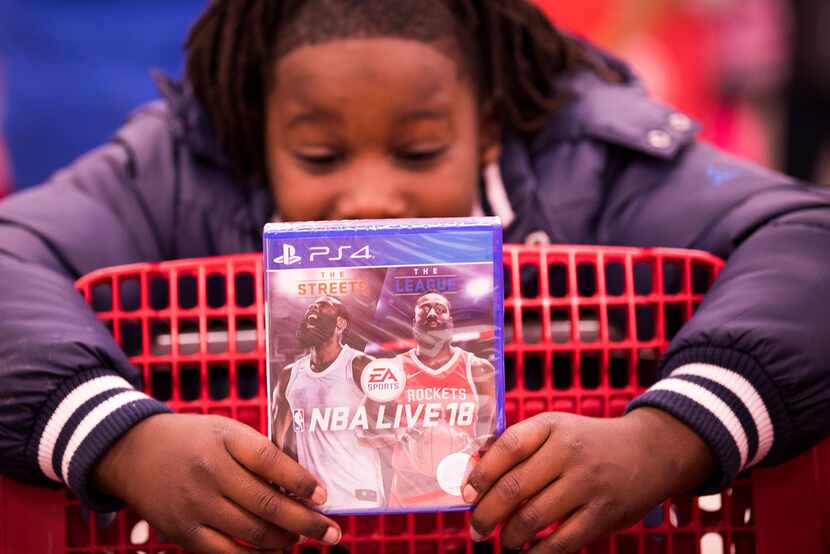 Martavionne Parker, 11, checked out a PlayStation game during the Target shopping spree.