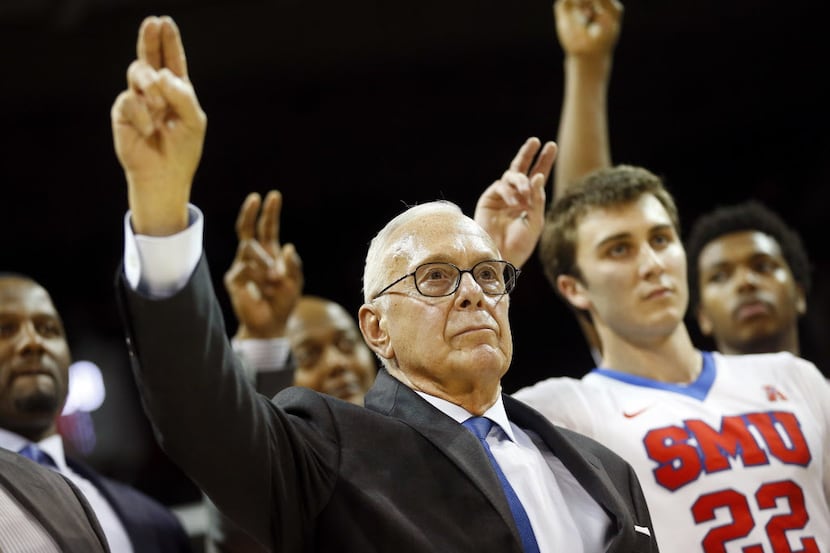 SMU Mustangs head coach Larry Brown joins his team in the alma mater following their 77-54...