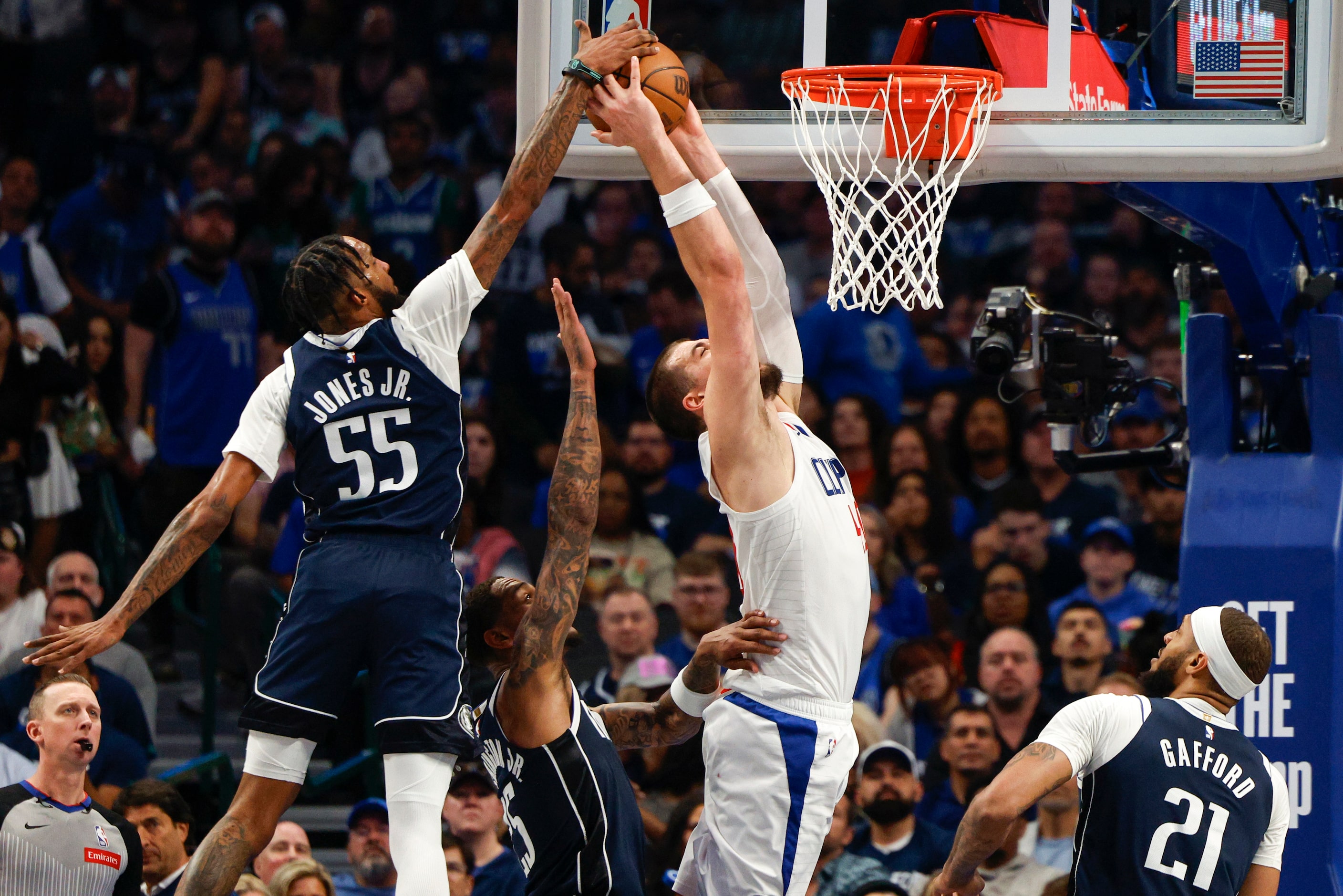 Dallas Mavericks forward Derrick Jones Jr. (55) blocks a dunk attempt from LA Clippers...