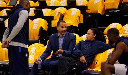 Dallas Mavericks general manager Nico Harrison (second from left) talks with Dallas...