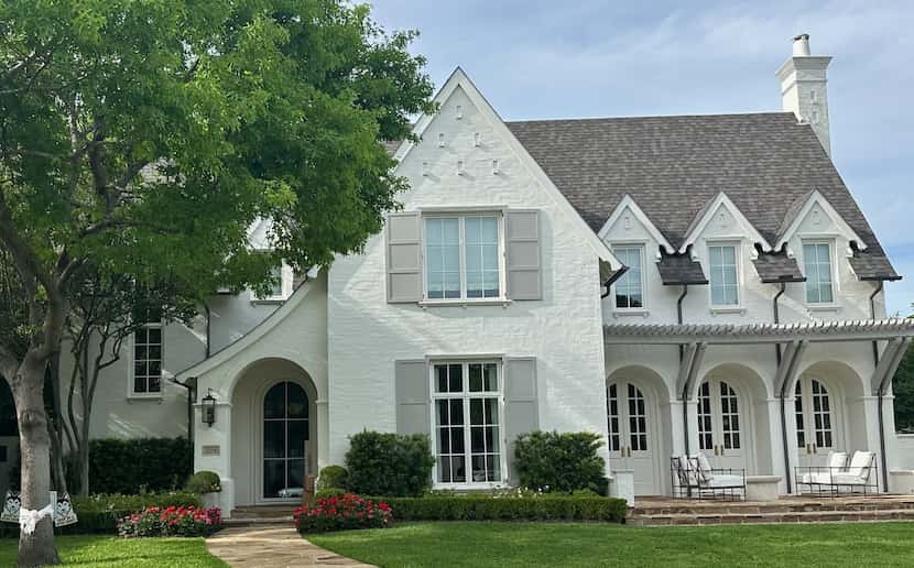 After: The exterior of this home was painted in Sherwin-Williams “Greek Villa," and a front...