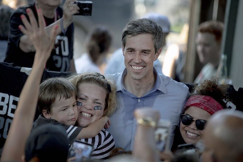 Democratic presidential candidate Beto O'Rourke poses for a photo with supporters following...