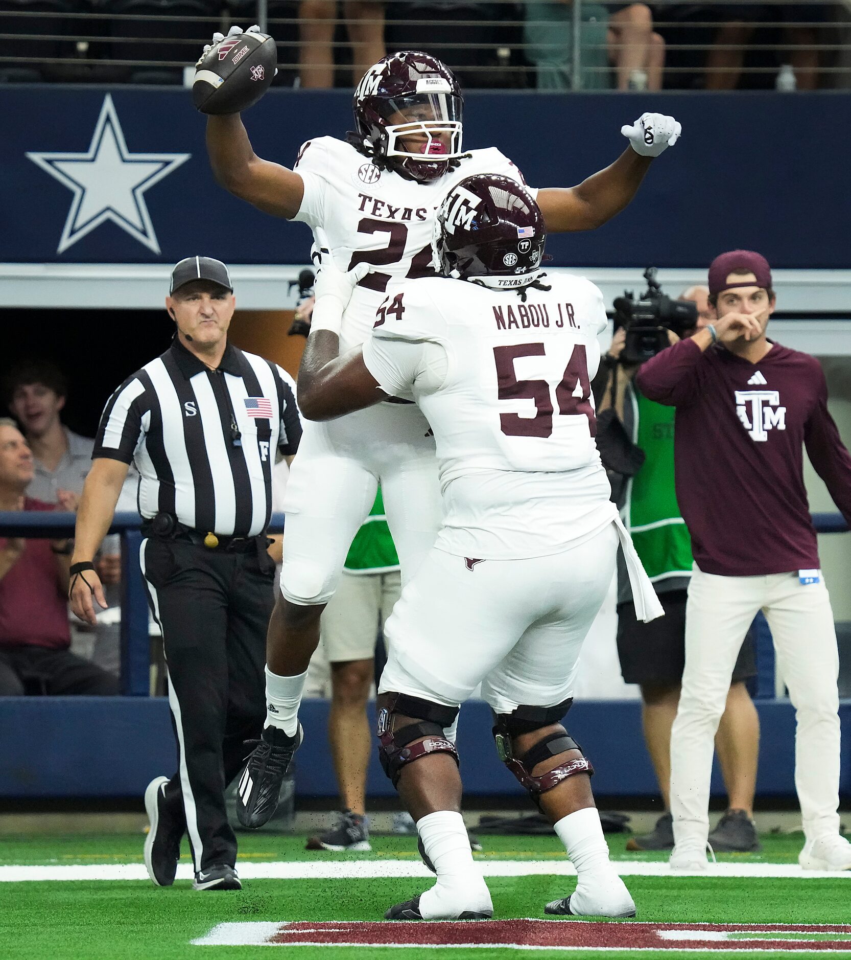 Texas A&M running back Earnest Crownover (24) celebrates with offensive lineman Mark Nabou...