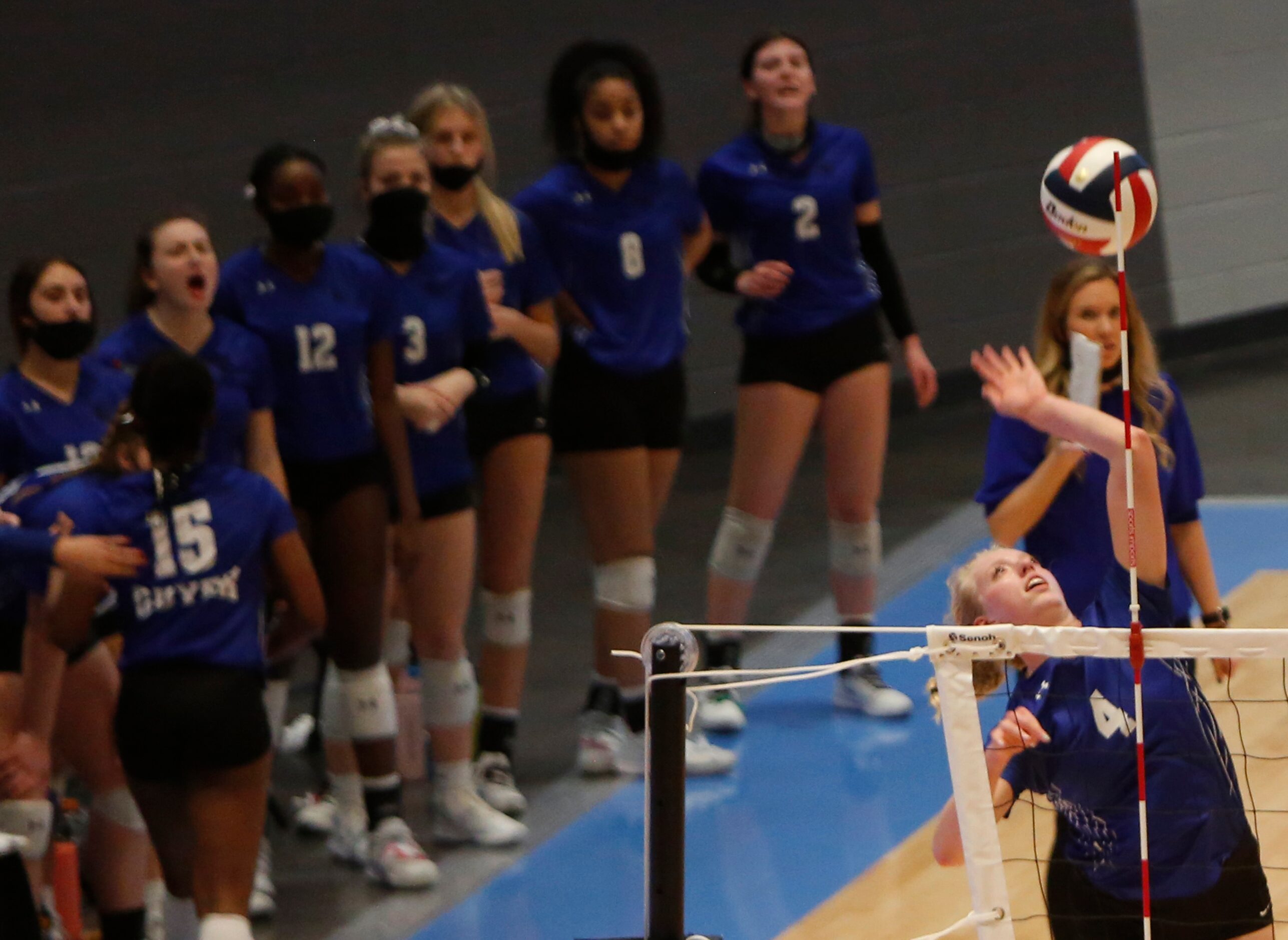 Denton Guyer's Brooke Slusser (4) fires a shot in front of the team bench during the second...