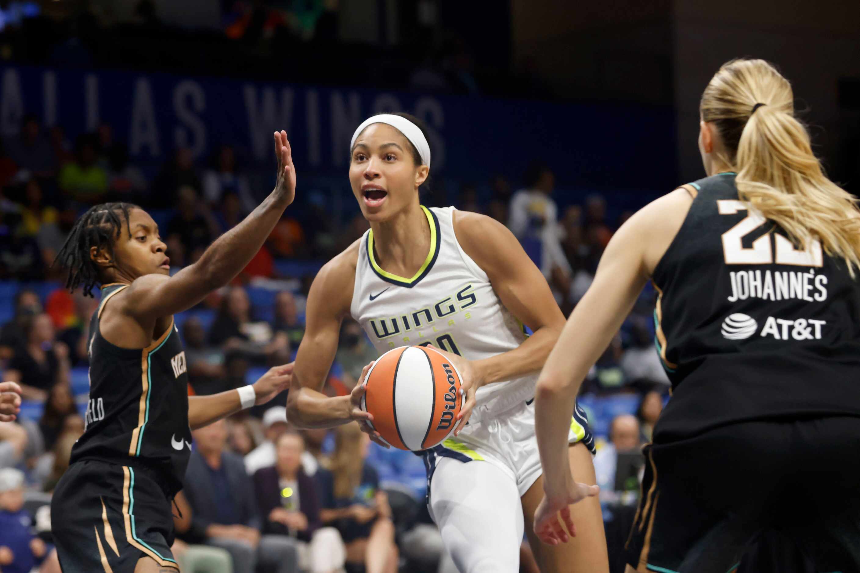Dallas Wings forward Isabelle Harrison (20) tries to get past New York Liberty’s Crystal ...