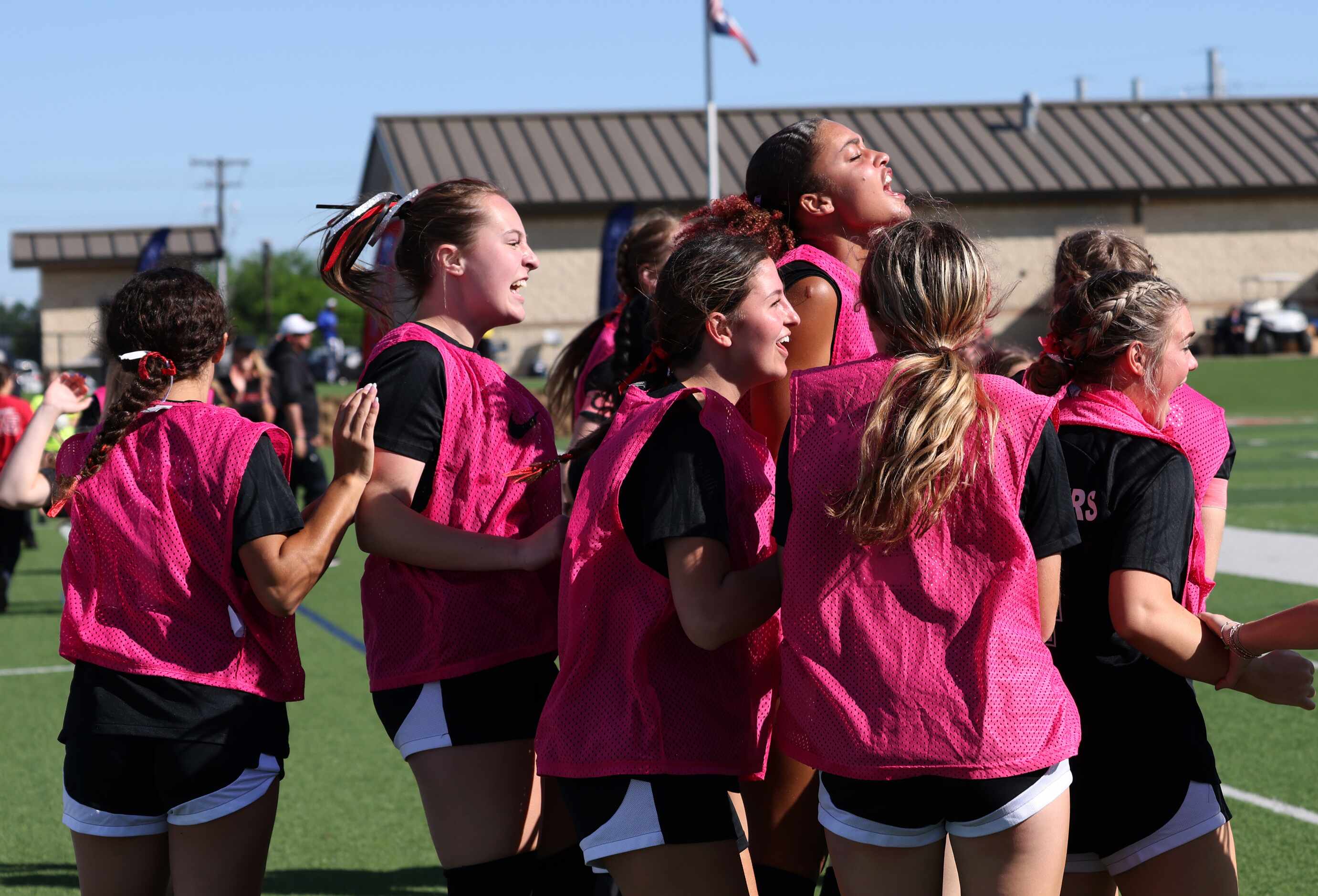  Colleyville Heritage players celebrate in the team bench area following a goal during first...