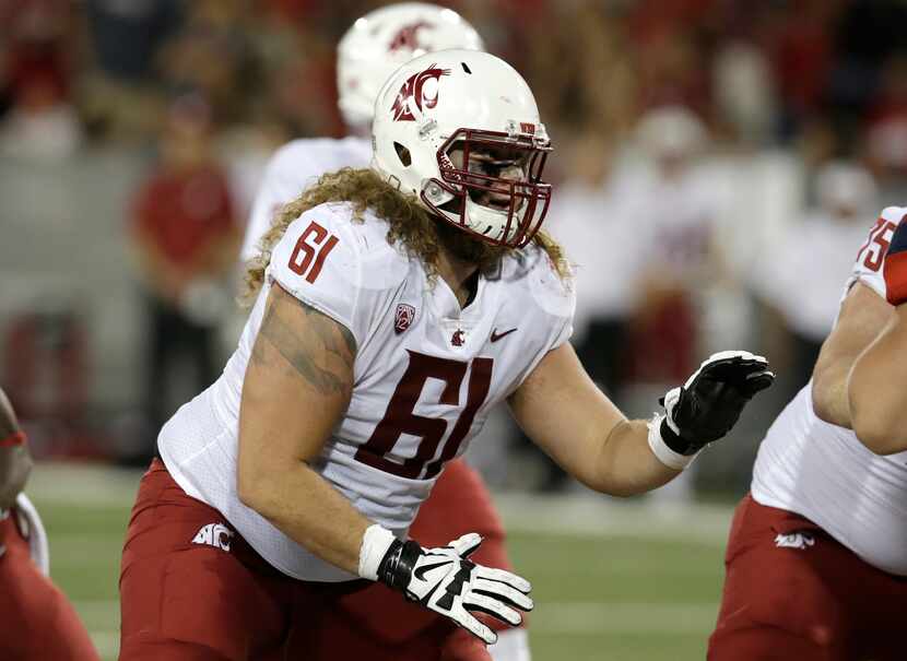 Washington State offensive lineman Cole Madison (61) in the first half during an NCAA...