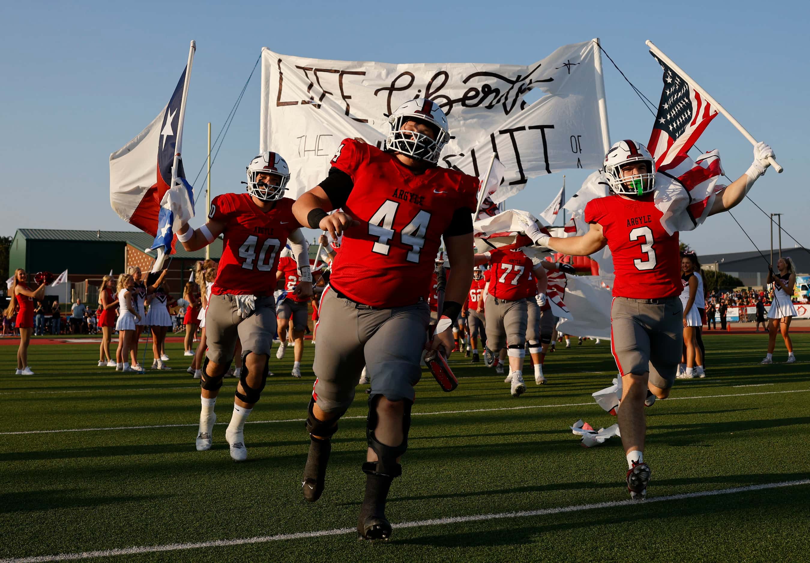 Argyle players run out to the field before a high school football game against Lovejoy at...