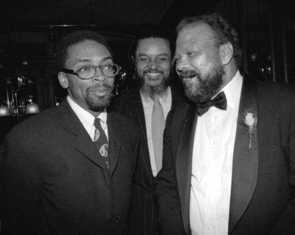 In this 1992 photo, Henry Hampton, right, speaks with Spike Lee as Massachusetts State...