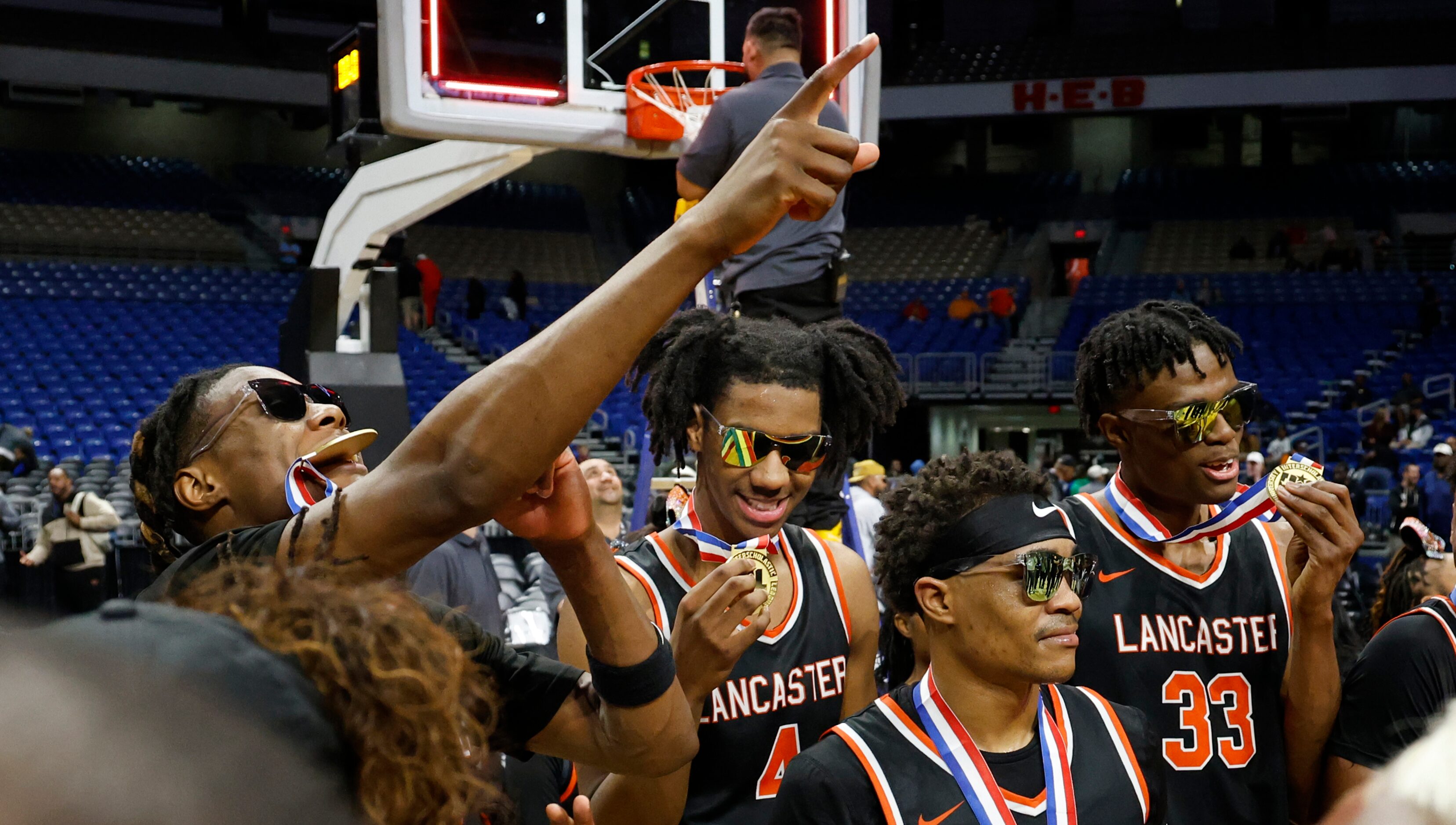 Lancaster's Dillon Battie (4) and Amari Reed (33) admire their medals after winning the UIL...