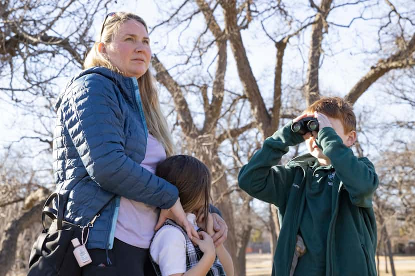 Michelle Gummer (from left), Sophia Gummer, 6, and Marcus Gummer, 8, watched a male bald...