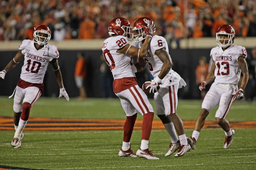 STILLWATER, OK - NOVEMBER 04: Safety Robert Barnes #20 and cornerback Tre Brown #6 of the...