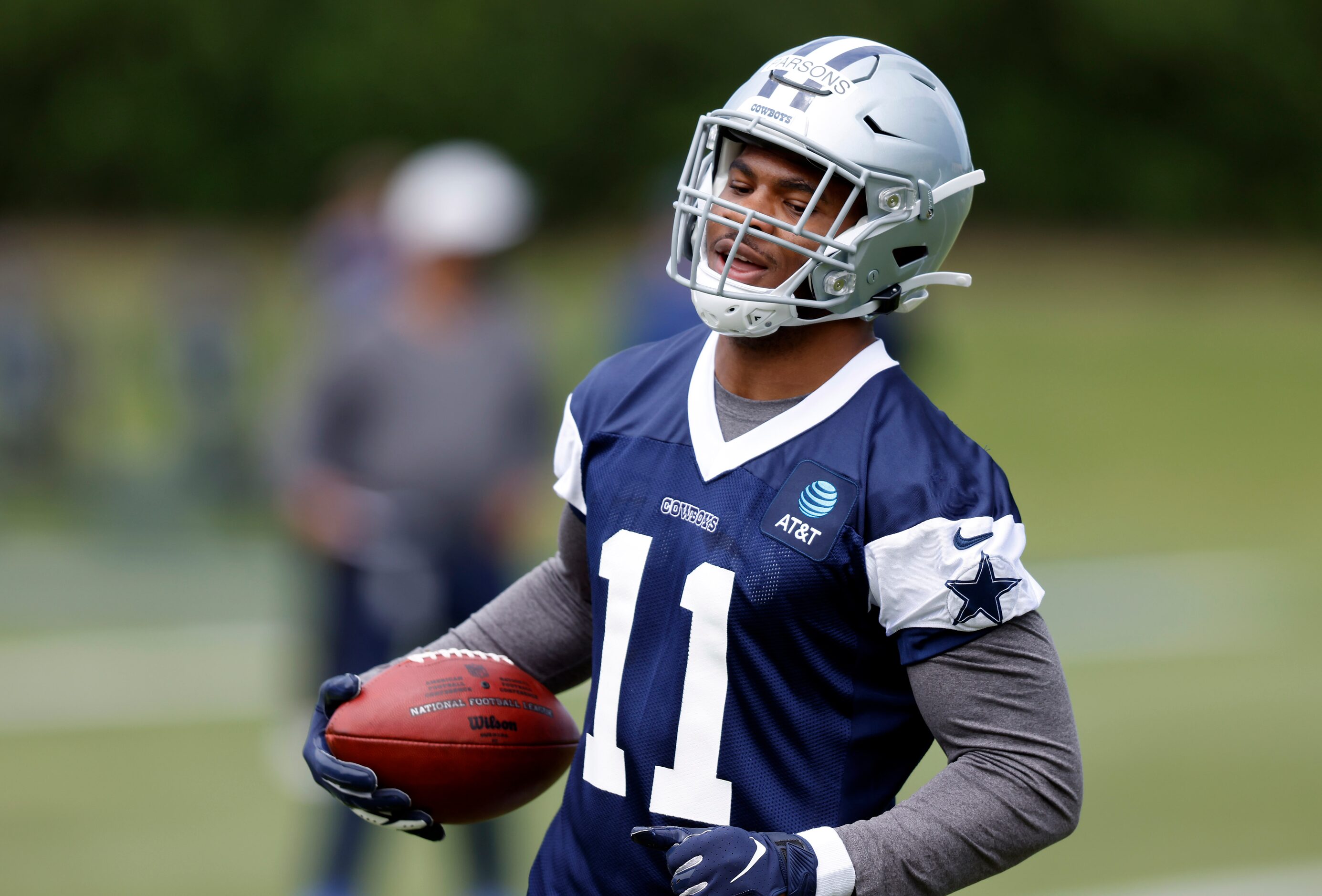 Dallas Cowboys rookie linebacker Micah Parsons (11) carries the ball during rookie minicamp...