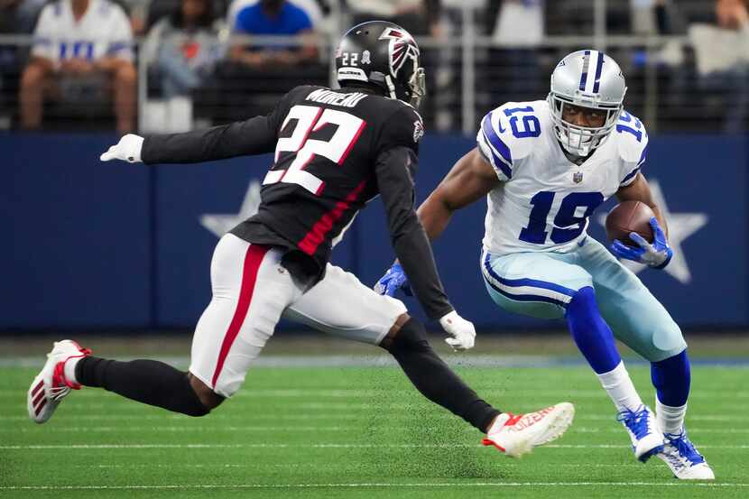 Dallas Cowboys wide receiver Amari Cooper (19) runs the ball against Atlanta Falcons...