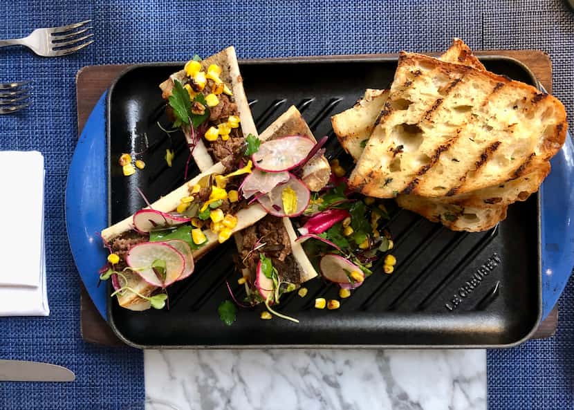 Roasted bone marrow at Wicked Butcher is served with charred corn and bread from Empire...