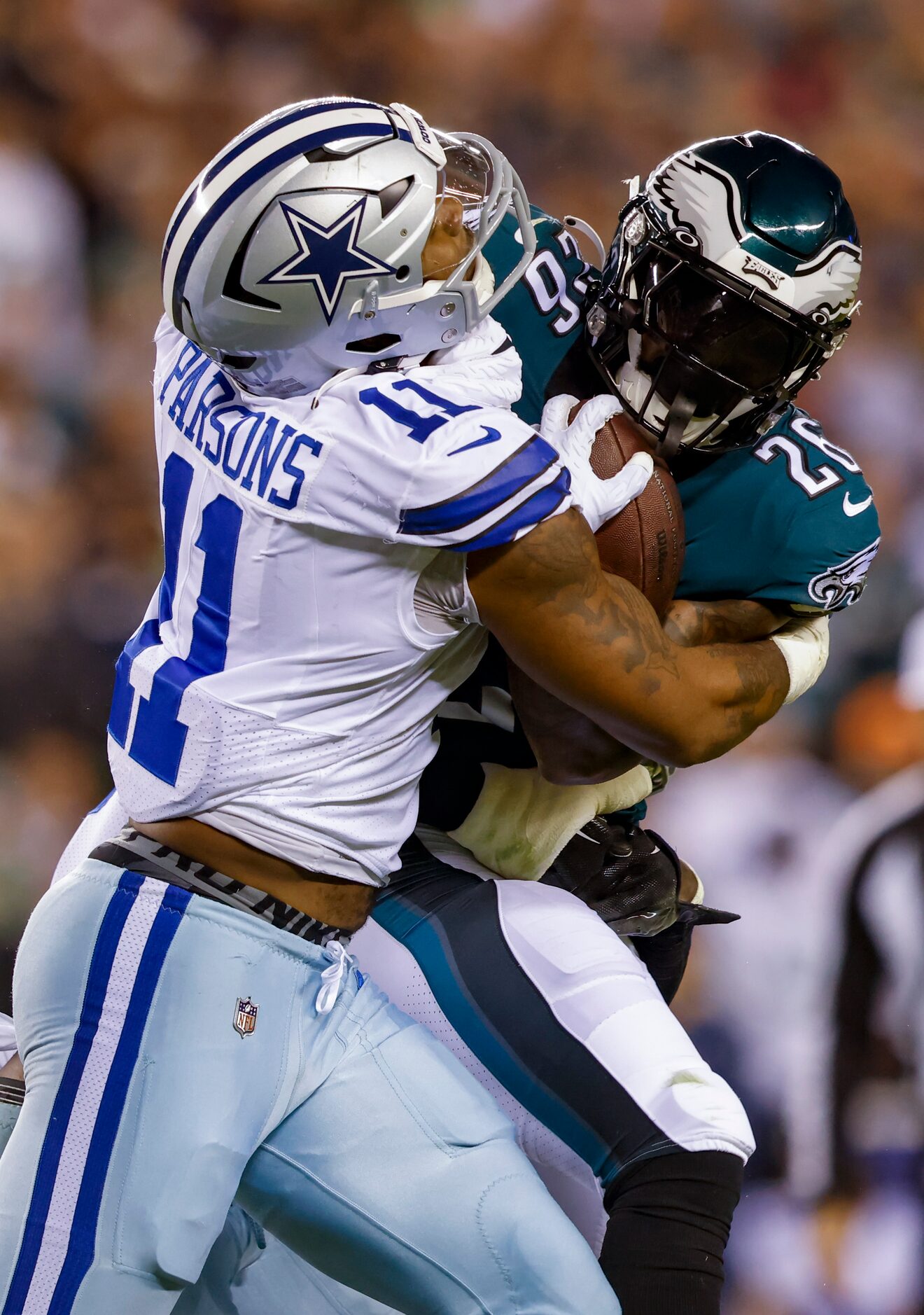 Dallas Cowboys linebacker Micah Parsons (11) tackles Philadelphia Eagles running back Miles...