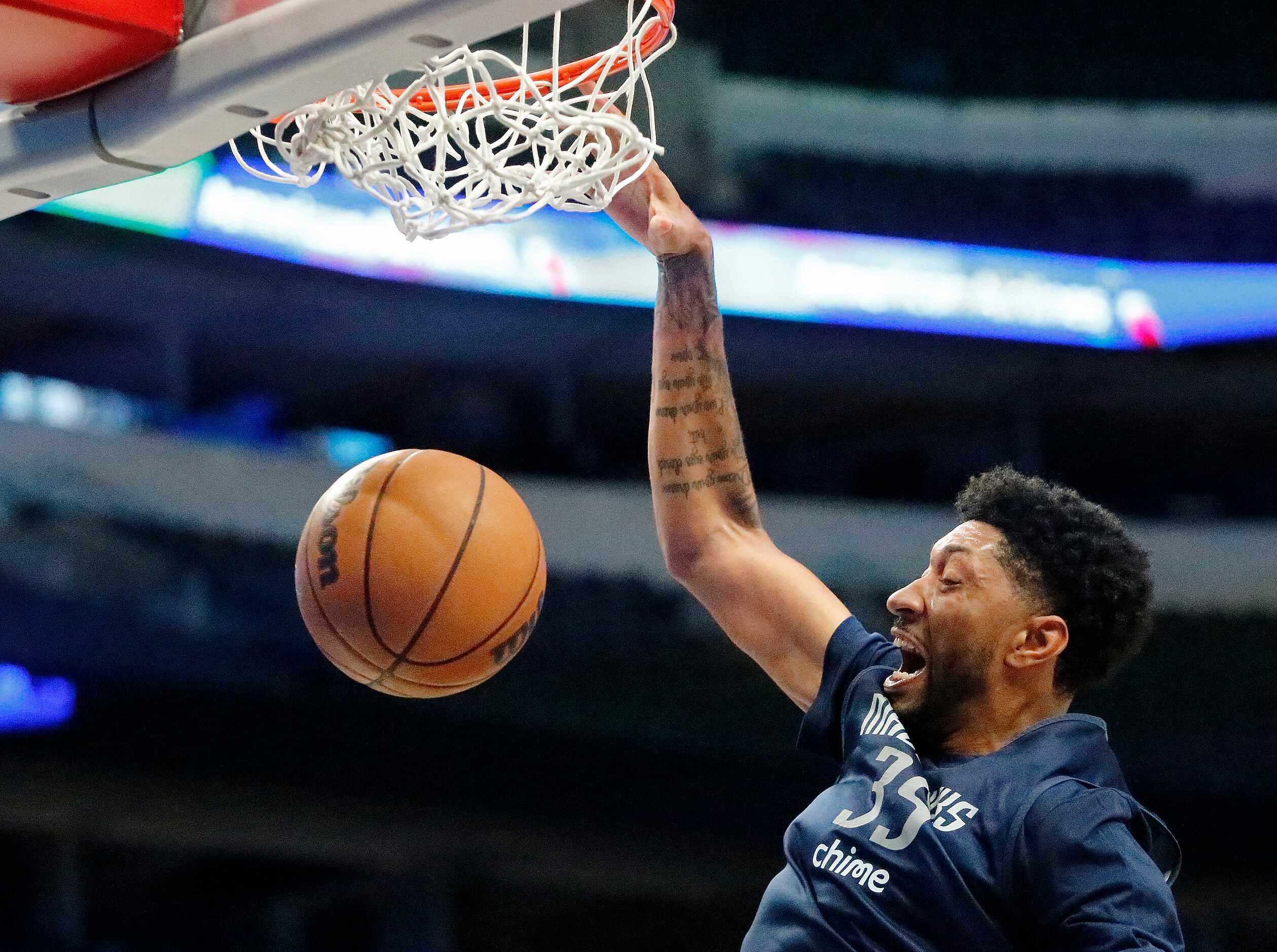 Dallas Mavericks center Christian Wood (35) gets a dunk at the Mavs Fan Jam, a free...