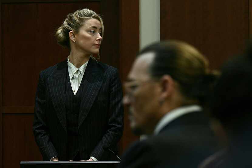Actors Amber Heard and Johnny Depp watched as the jury came into the courtroom after a lunch...