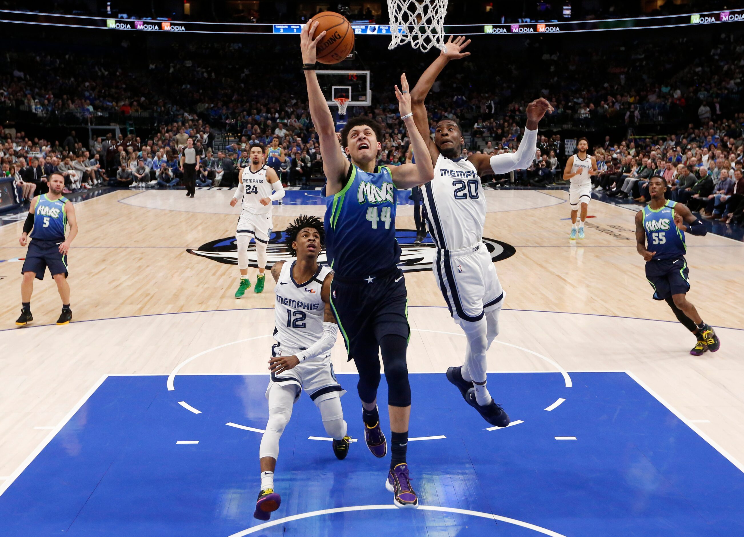 Dallas Mavericks forward Justin Jackson (44) attempts a layup in front of  Memphis Grizzlies...