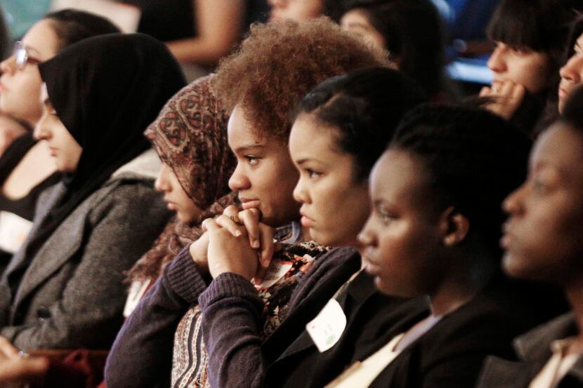 
Asha Beacham (center) and others listened to a presentation of part of IGNITE, a national...