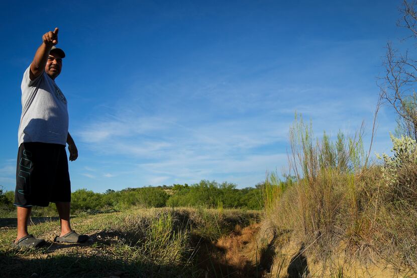 Renee Herrera points out the area where DPS Special Agent Anthony Salas died in the crash of...