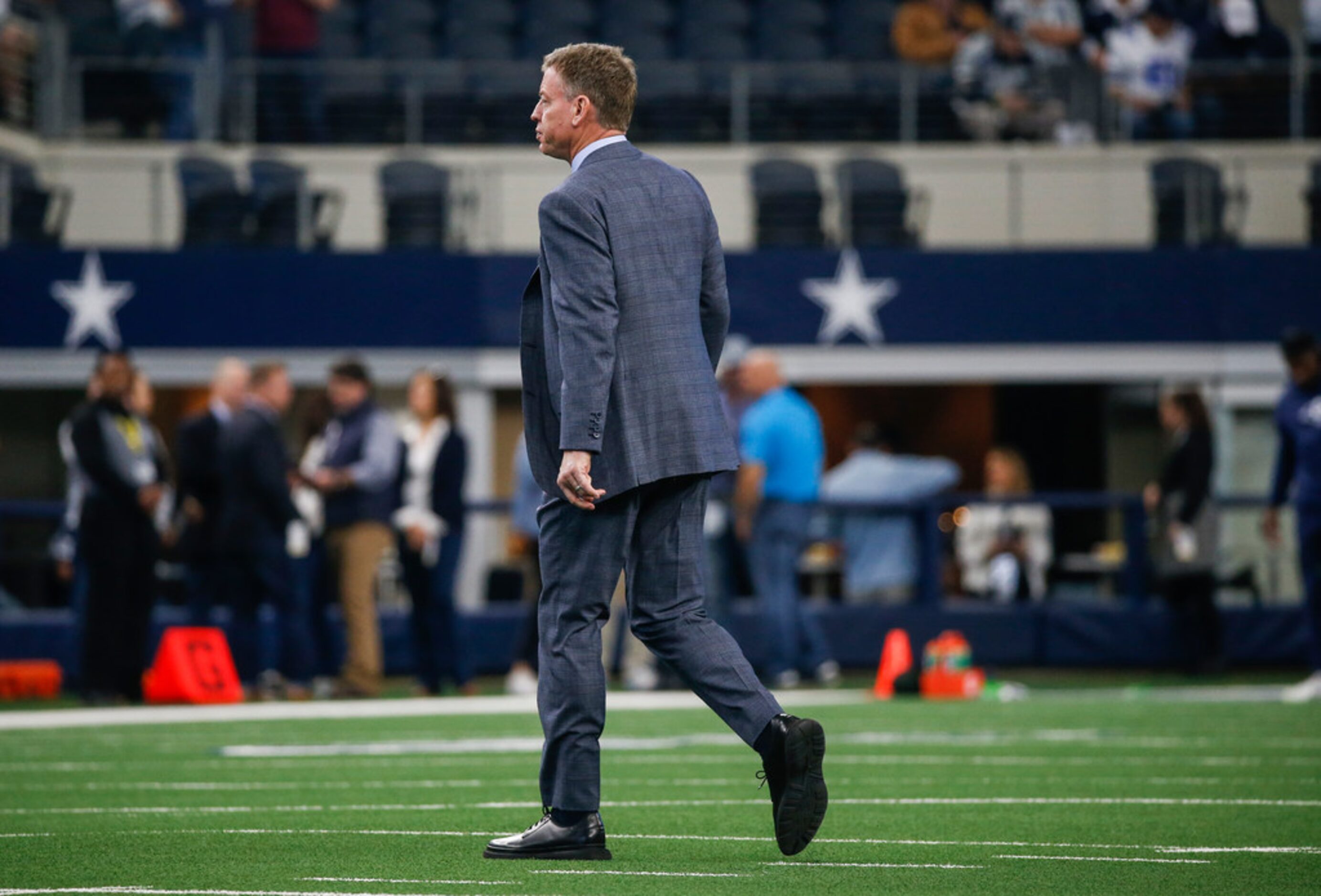 Troy Aikman walks the field prior to an NFL matchup between the Dallas Cowboys and the Los...