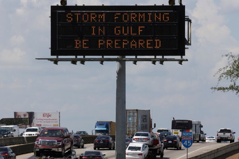 Motorists in Houston passed a sign warning of Hurricane Harvey as the storm intensified in...
