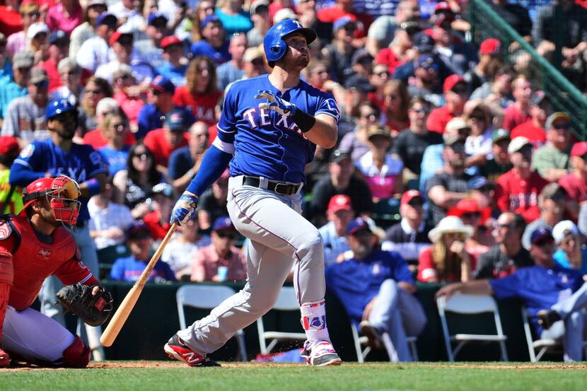 TEMPE, AZ - MARCH 13:  Joey Gallo #13 of the Texas Rangers hits a solo home run in the...