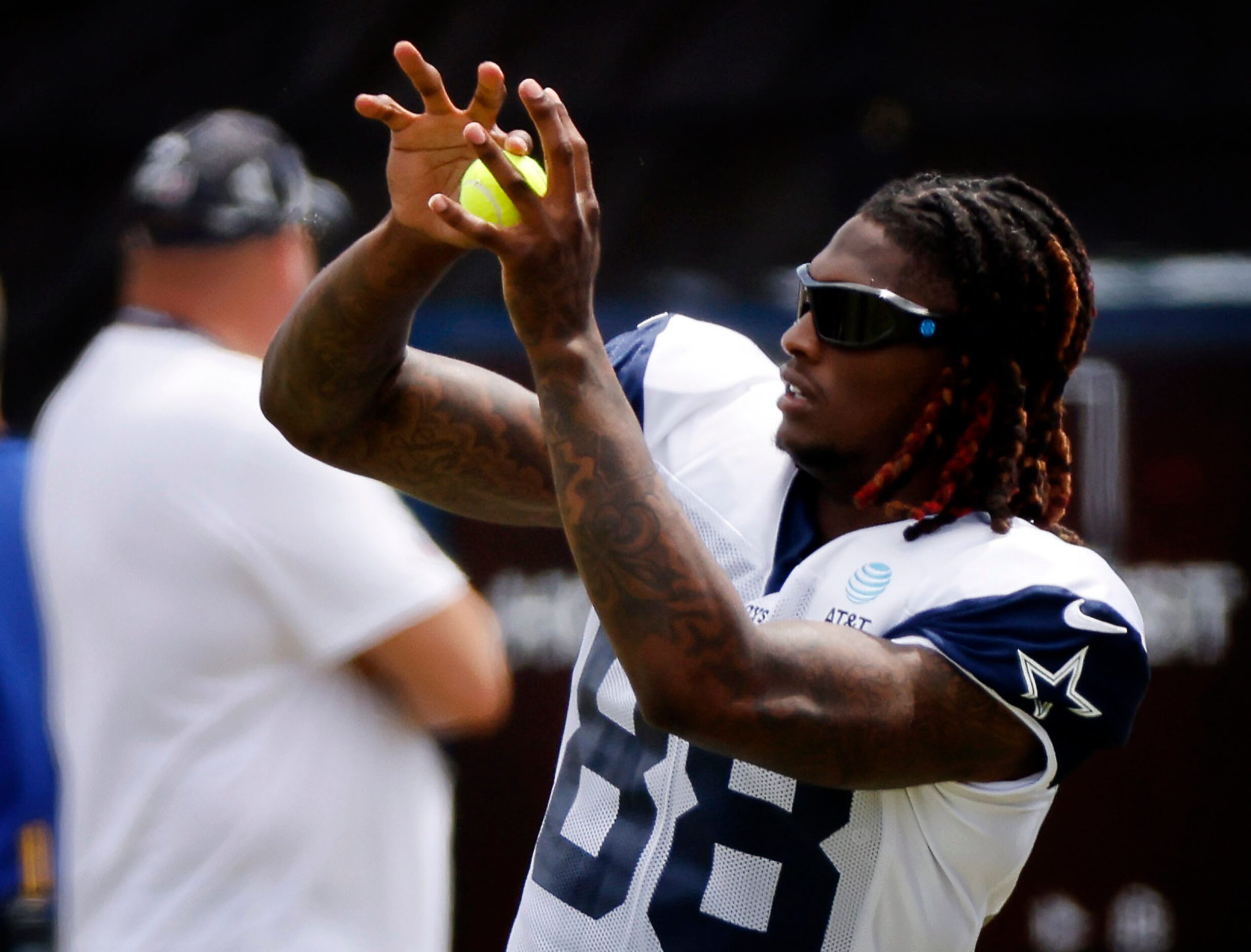 Dallas Cowboys wide receiver CeeDee Lamb (88) catches tennis balls during training camp...