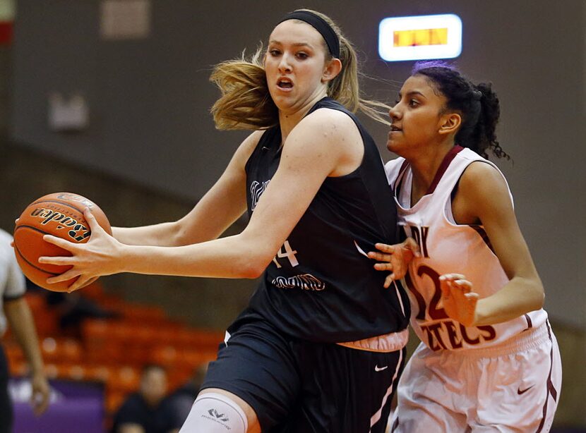 Flower Mound center Lauren Cox (44) drives the lane past El Paso El Dorado guard Ebonie...