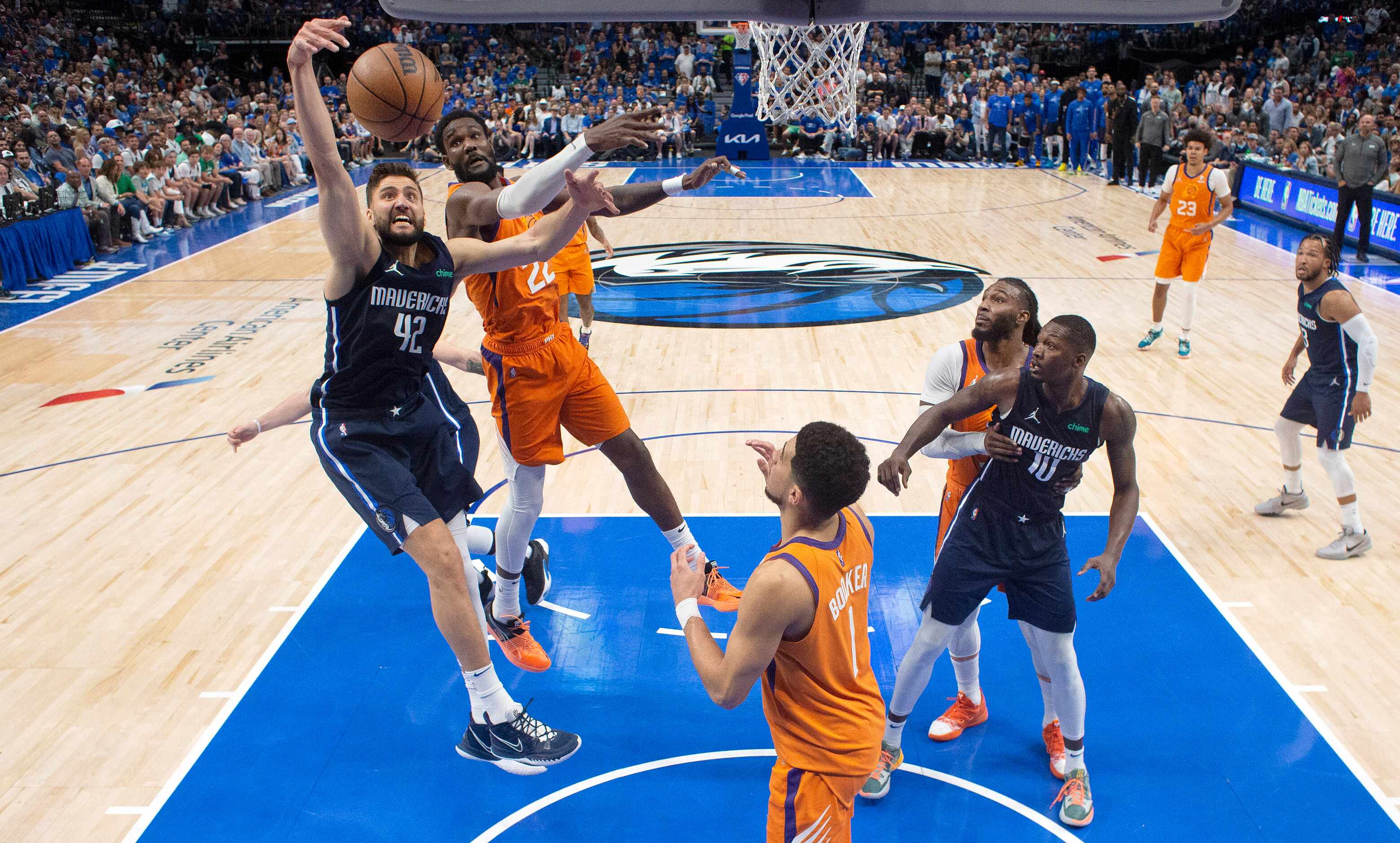 Dallas Mavericks forward Maxi Kleber (42) and Phoenix Suns center Deandre Ayton (22) battle...